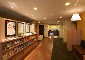 a lobby of a restaurant with a store with food at Smile Hotel Tokyo Asagaya in Tokyo