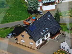 an aerial view of a house with a roof at Appart-Ascolino in Siebenbach