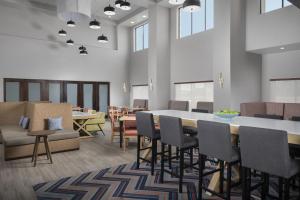 a dining room with a table and chairs at Hampton Inn & Suites - Mansfield in Mansfield +28 photos