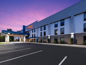 an empty parking lot in front of a hotel at Hampton Inn Sanford in Sanford