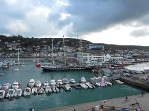 a group of boats are docked in a harbor at Hotel Le Grand Pavois in Fécamp