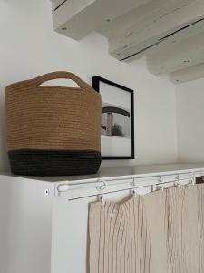 a basket sitting on top of a shelf in a closet at La Suite Bellifontaine in Fontainebleau +26 photos