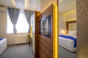 Katil atau katil-katil dalam bilik di Privilege Suites by Central Park
