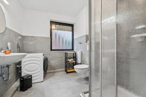 a bathroom with a toilet and a sink at Sali-Homes Monteur Stay in Kleve +50 photos