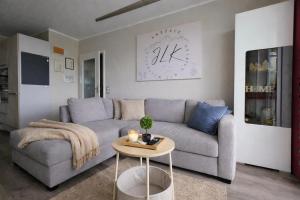 a living room with a couch and a table at ErzZeit Urlaub mit Weitblick in Schwarzenberg/Erzgebirge