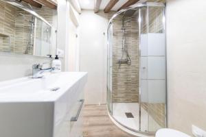 a bathroom with a shower and a sink at Cozy Attic in the City Center of Soria in Soria