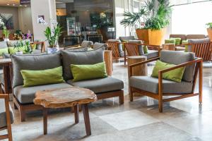 a store with chairs and a couch and a table at Hilton Garden Inn Veracruz Boca del Rio in Veracruz