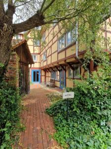 a brick sidewalk in front of a building at Hotel Beere in Salzwedel
