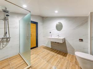a bathroom with a sink and a shower at Къща за гости "Mirror Lake" in Smolyan +86 photos