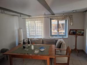 a living room with a table and a couch at Hotel Beere in Salzwedel +23 photos
