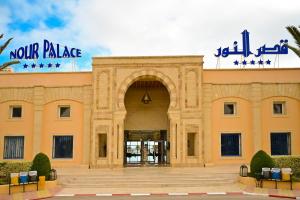a building with a large archway in front of it at Hotel Nour Palace Resort & Thalasso Mahdia in Mahdia