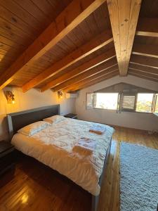 a bedroom with a large bed in an attic at Gem Guest House in Lazarat +6 photos
