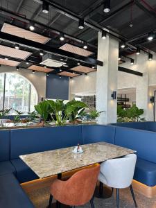 a dining room with a table and two chairs at Ibis Styles Subic in Olongapo +20 photos