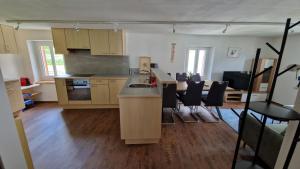 a kitchen with a sink and a counter top at Ferienwohnung Tulipana in Müstair