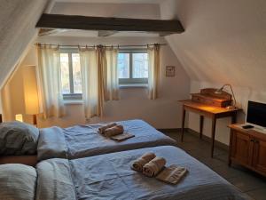 a bedroom with two teddy bears on a bed at Hotel Beere in Salzwedel