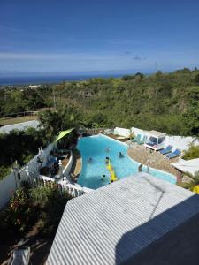a view of a swimming pool at a resort at Le Paille en Queue in Saint-Louis