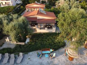 an aerial view of a house with chairs and a table at Alkiones in Platy