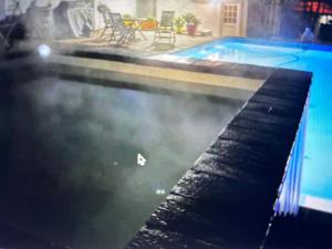a swimming pool with smoke coming out of it at Greyton Toad Hall in Greyton