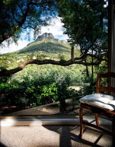 a room with a window with a view of a mountain at Mereweather Estate Cottage in Dunkeld