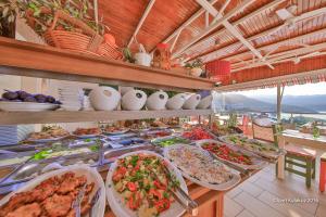 a buffet with many plates of food on a table at Hotel Sonne - Adults Only in Kaş