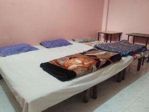a couple of beds in a room at affordable homes in Prayagraj