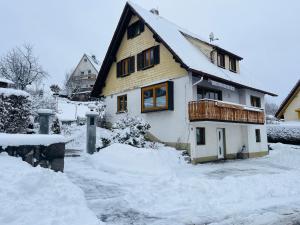 a house is covered in snow at Schwarzwald-Nest Lenzkirch in Lenzkirch