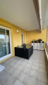 a room with a table and a large window at Appartement 3P Nice in Nice