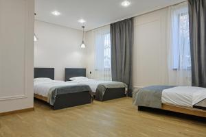 a hotel room with two beds and a window at Ani Hotel in Maralik