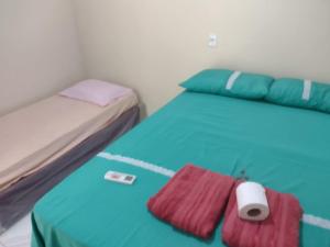 a bedroom with two beds at pousada ondas do atlântico in Salinópolis