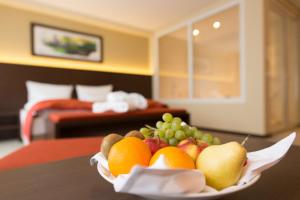 Postel nebo postele na pokoji v ubytování Aribo Hotel
