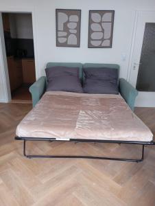 a bed in a room with a bed frame at Triberg City Apartment 1 in Triberg