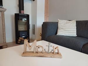 a living room with a coffee table with a couch and a tv at Hygge in Wrixum +12 photos