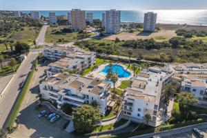 an aerial view of houses and the ocean at Vila da Praia by ALgest in Alvor