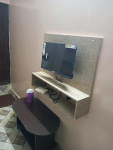 a tv on a wall in a room at ComfortInn in Chennai