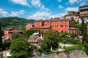 a group of buildings in a town on a hill at Hotel Villa Sermolli in Borgo a Buggiano