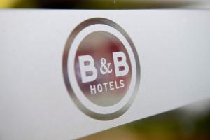 En logo, et sertifikat eller et firmaskilt på B&B HOTEL Lens Noyelles-Godault