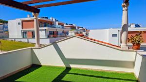 a view from the balcony of a house with green grass at Casa Lu in Salir de Porto