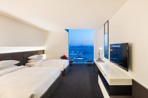 Postel nebo postele na pokoji v ubytování Hotel Ora Incheon + 37 fotografií