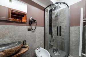 a bathroom with a sink and a shower at Hotel Jumeaux in Breuil-Cervinia +47 photos
