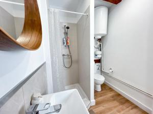 a bathroom with a sink and a toilet at Chic Home - Turckheim in Turckheim +19 photos