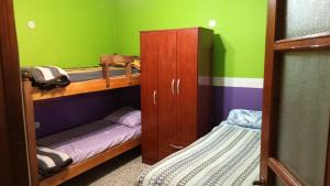 a room with two bunk beds and a closet at Ester in San Antonio Oeste
