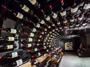 a wall of wine bottles in a wine cellar at Hotel Fliana 4-Sterne Superior in Ischgl +65 photos