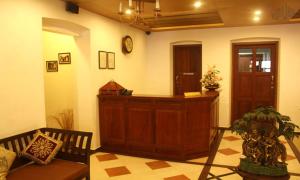 a court room with a bench and a desk in it at THE HILLWAY HERITAGE in Trivandrum