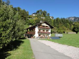 a house with a pathway leading to it at Apartment Furschermuehle in Siusi