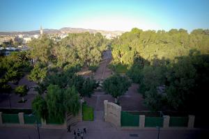 an aerial view of a park with trees and people at Apparts-hôtel ISNI in Agadir