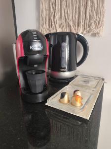 a coffeemaker and a coffee maker on a counter at Panamera 8 in Sousse
