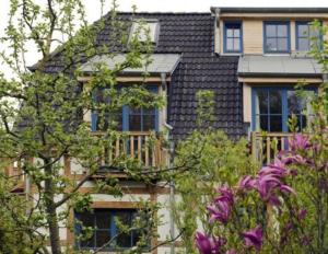 a house with a bunch of trees in front of it at Landgut Jungbrunnen in Glashagen