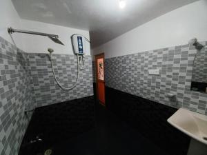 a bathroom with a shower and a sink at Sethun House in Mirissa