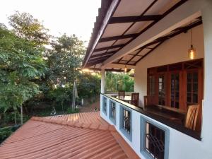 an outside view of a house with a roof at Sethun House in Mirissa