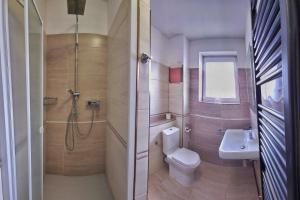 a bathroom with a shower and a toilet and a sink at MOTOREST-PENSION U HRACHŮ,s.r.o. in Klatovy +15 photos